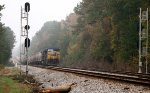 CSX 117 and 5465 wait for green with a line of covered hoppers at the N.E. Aberdeen signals